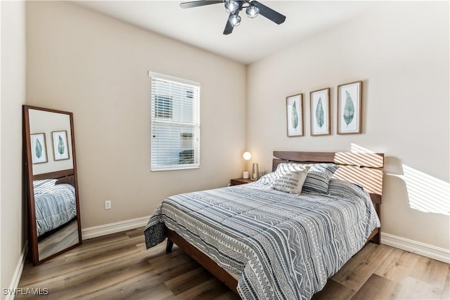 bedroom featuring hardwood / wood-style floors and ceiling fan