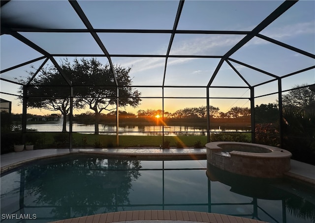 7821 Ashton Rd, Naples, FL 34113 - view of swimming pool featuring a water view, a lanai, a pool with connected hot tub, and a patio area