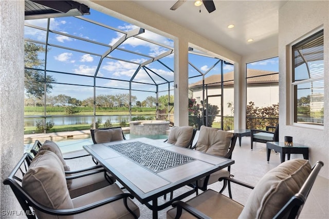 7821 Ashton Rd, Naples, FL 34113 - view of patio featuring a water view, a ceiling fan, a lanai, and outdoor dining area