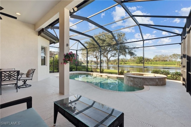 7821 Ashton Rd, Naples, FL 34113 - view of pool with a water view, a patio, a lanai, and a pool with connected hot tub