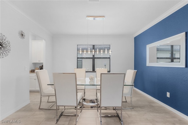 dining space with ornamental molding