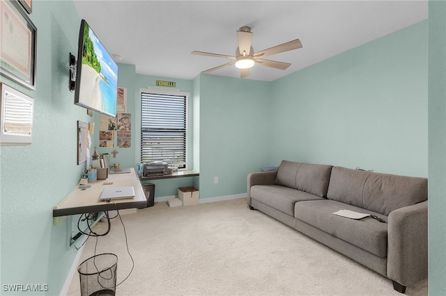 living room with carpet flooring, ceiling fan, and plenty of natural light