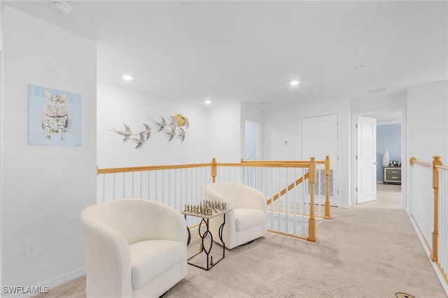 living area with light colored carpet