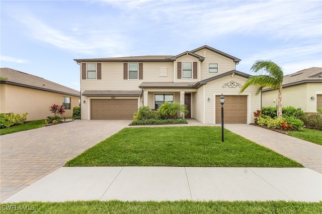 view of front of house with a front lawn and a garage