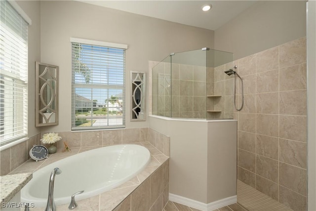 bathroom with a garden tub and walk in shower