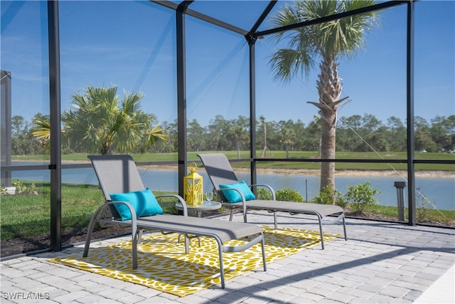 unfurnished sunroom with a water view