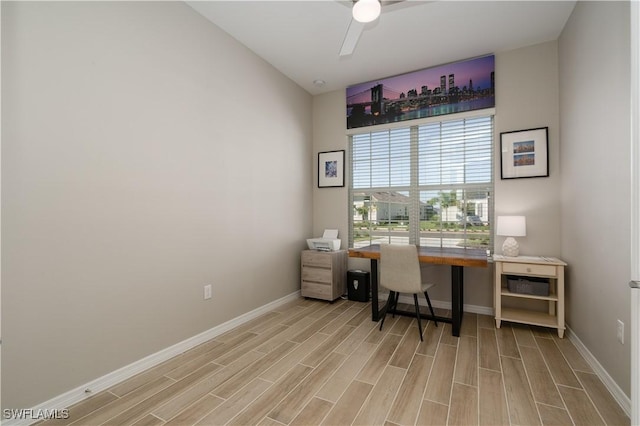 office with ceiling fan, vaulted ceiling, and light hardwood / wood-style floors