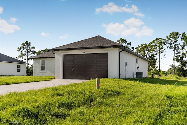 exterior space featuring central air condition unit and a lawn