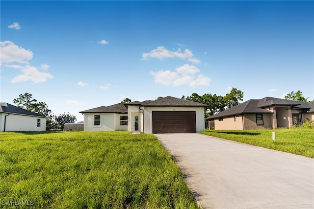 view of front of house featuring a front yard and a garage