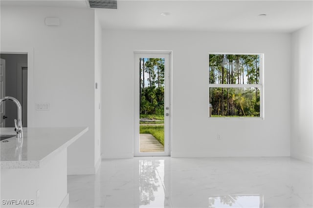 interior space featuring sink and plenty of natural light