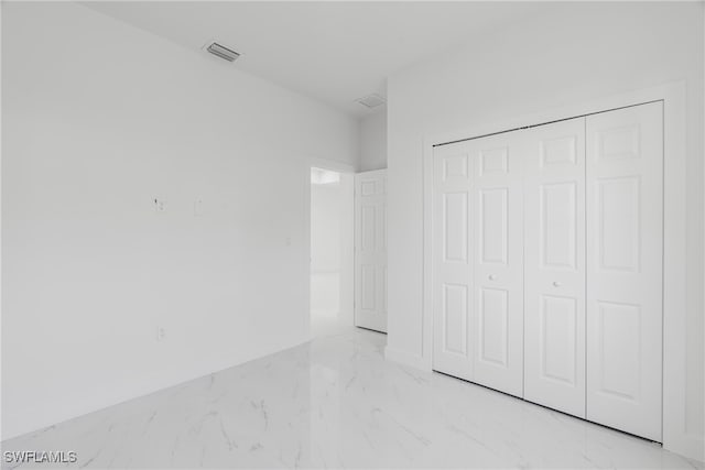 unfurnished bedroom with a closet