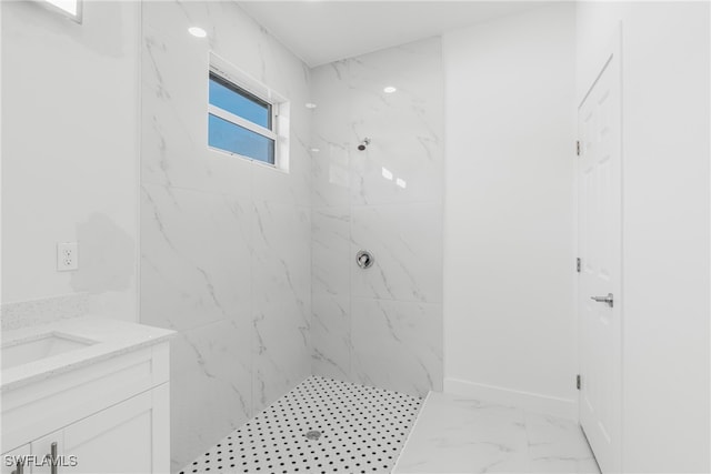 bathroom featuring vanity and a tile shower