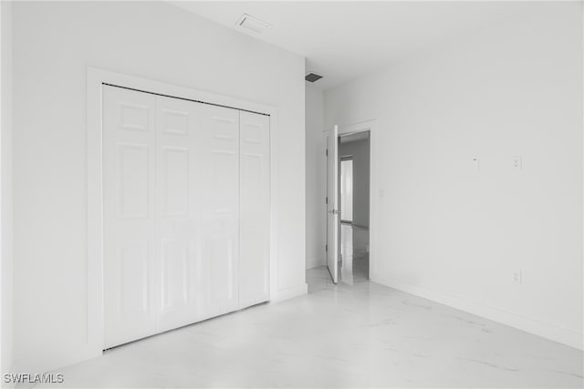 unfurnished bedroom featuring a closet