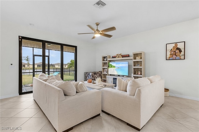 living room with light tile patterned flooring and ceiling fan