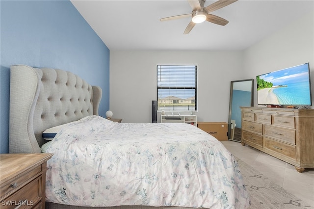 bedroom with light tile patterned floors and ceiling fan