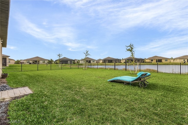 view of yard with a water view