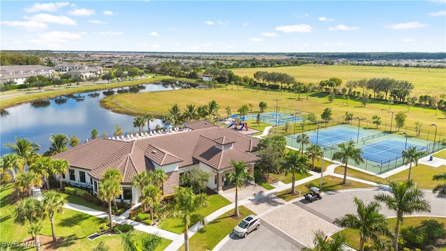 birds eye view of property with a water view