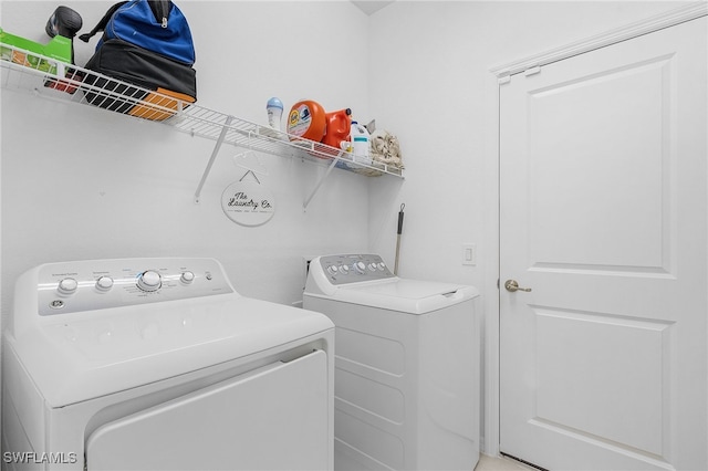 washroom with separate washer and dryer