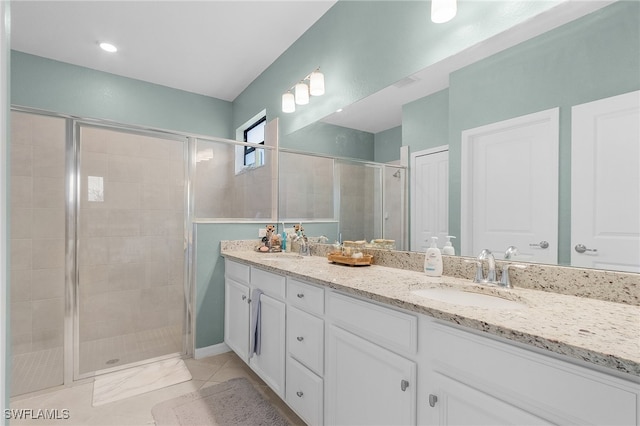 bathroom featuring an enclosed shower and vanity