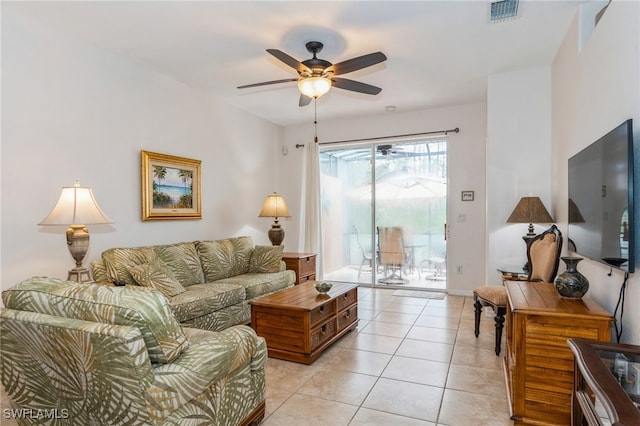 living room with light tile patterned flooring and ceiling fan