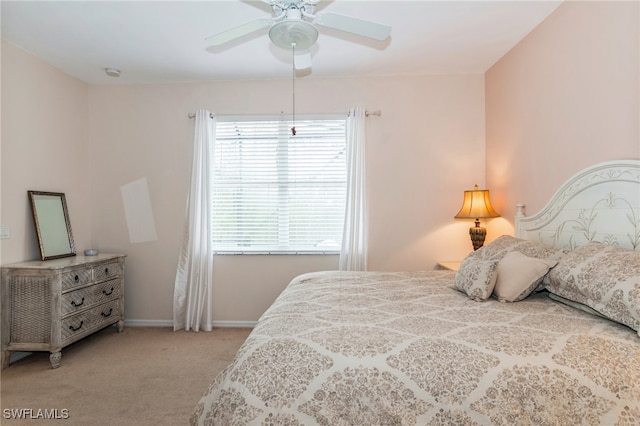 bedroom with light colored carpet and ceiling fan