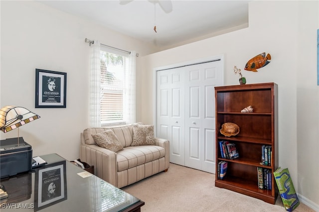 carpeted office featuring ceiling fan