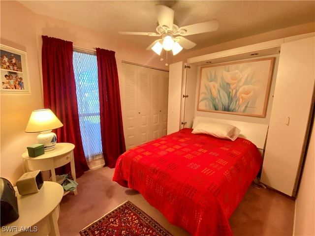 carpeted bedroom with a closet and ceiling fan