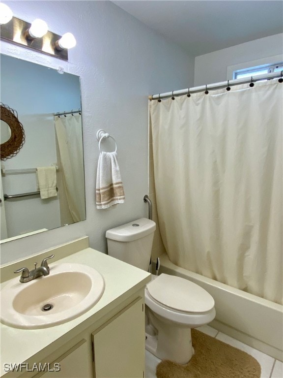 full bathroom featuring toilet, vanity, shower / bath combination with curtain, and tile patterned flooring