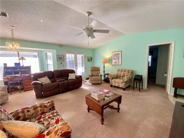 living room with light carpet, a textured ceiling, lofted ceiling, and ceiling fan