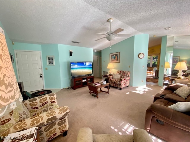 carpeted living room with lofted ceiling, a textured ceiling, and ceiling fan