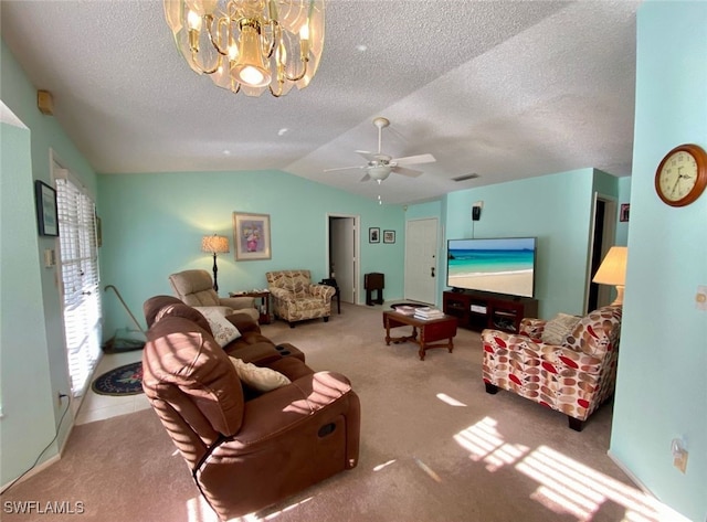 carpeted living room with lofted ceiling, a textured ceiling, and ceiling fan with notable chandelier