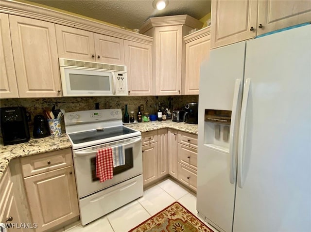 kitchen featuring decorative backsplash, light tile patterned flooring, light stone counters, a textured ceiling, and white appliances