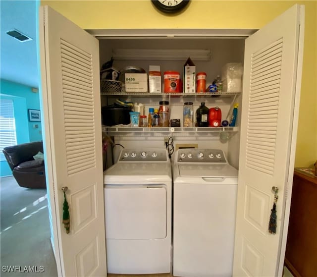 laundry room featuring separate washer and dryer