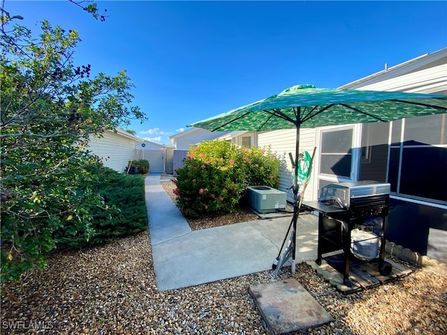 view of yard with a patio area and central AC unit