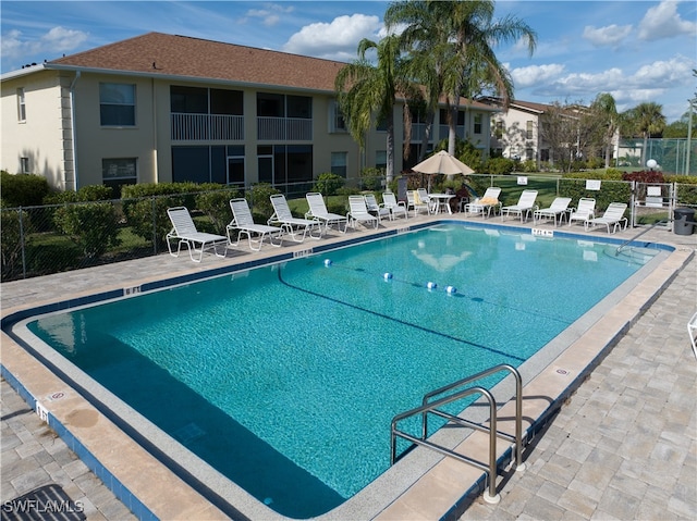 view of swimming pool with a patio