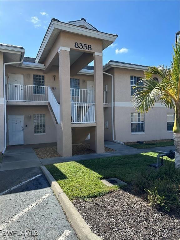 8358 Bernwood Cove Loop Unit 706, Fort Myers, FL 33966 - view of building exterior featuring stairway