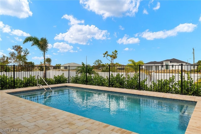 view of pool with fence and a fenced in pool