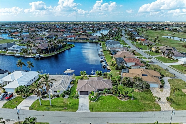 birds eye view of property featuring a water view