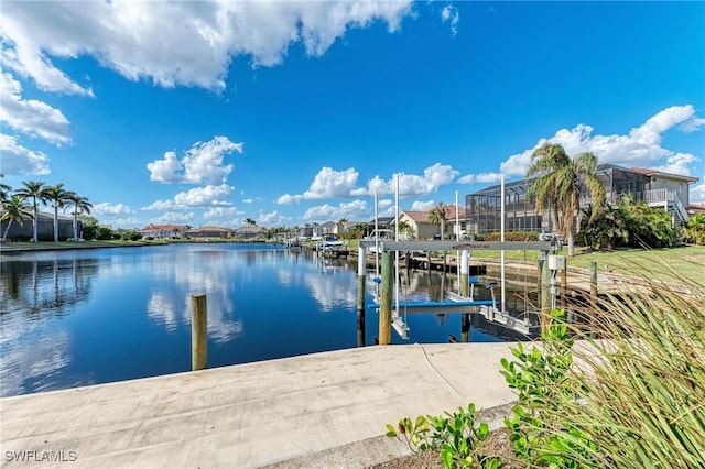 dock area with a water view and glass enclosure