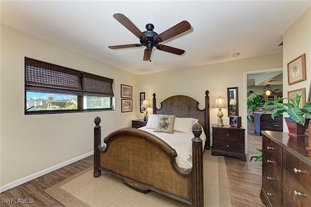 bedroom with ceiling fan and hardwood / wood-style floors