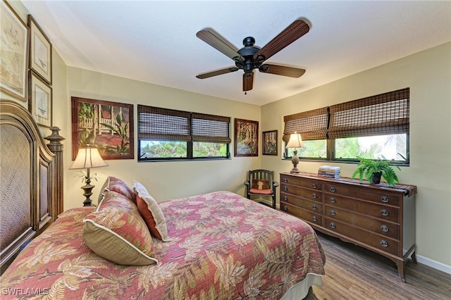 bedroom featuring wood-type flooring and ceiling fan