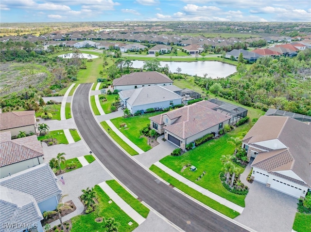 birds eye view of property with a water view