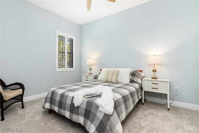 bedroom with ceiling fan and light colored carpet