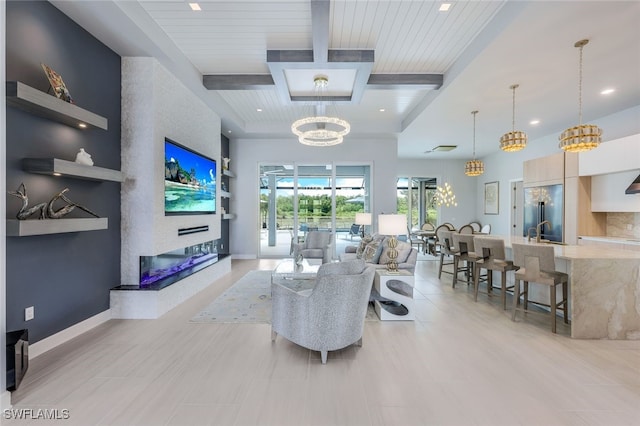 living room with light tile patterned flooring, beamed ceiling, sink, a large fireplace, and wood ceiling