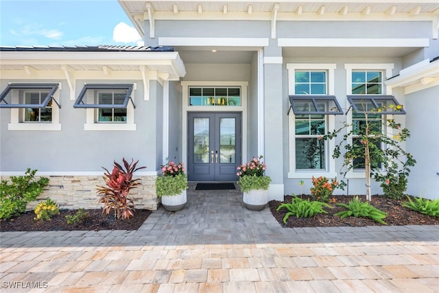 property entrance featuring french doors