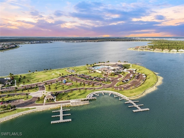 aerial view at dusk with a water view