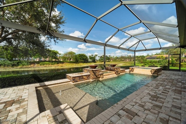 view of pool with a lanai, an in ground hot tub, a water view, and a patio area