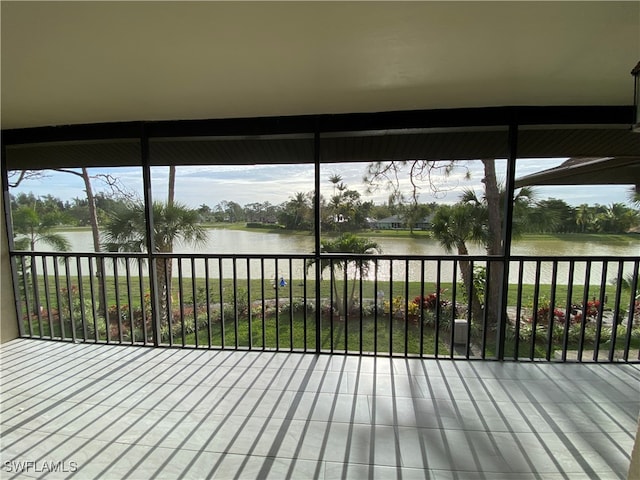 wooden deck with a water view