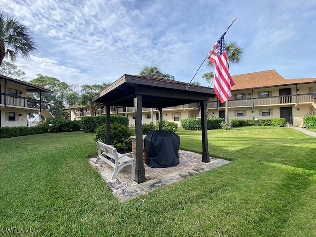 view of yard featuring a balcony