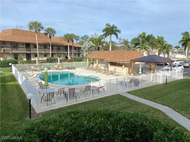 view of pool featuring a yard, a patio, and a gazebo